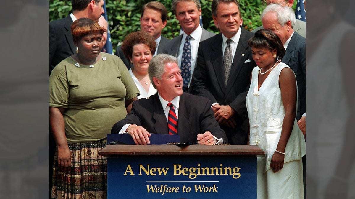 President Clinton prepares to sign legislation in the Rose Garden of the White House Thursday