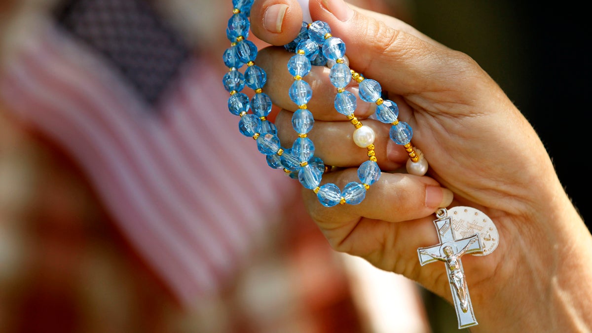  A demonstrator holds rosary beads during a protest against the Obama administration mandate that employers provide workers birth control coverage, at Independence Mall, Friday, June 8, 2012, in Philadelphia. The event was organized by Stand Up For Religious Freedom. (Matt Rourke/AP Photo, file) 