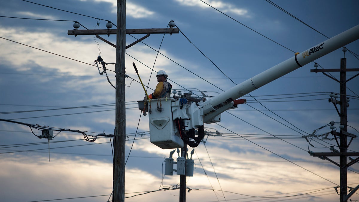  Workers work to repair power lines Friday, July 4, 2014 damaged by Hurricane Arthur. (Randall Hill/AP Photo) 