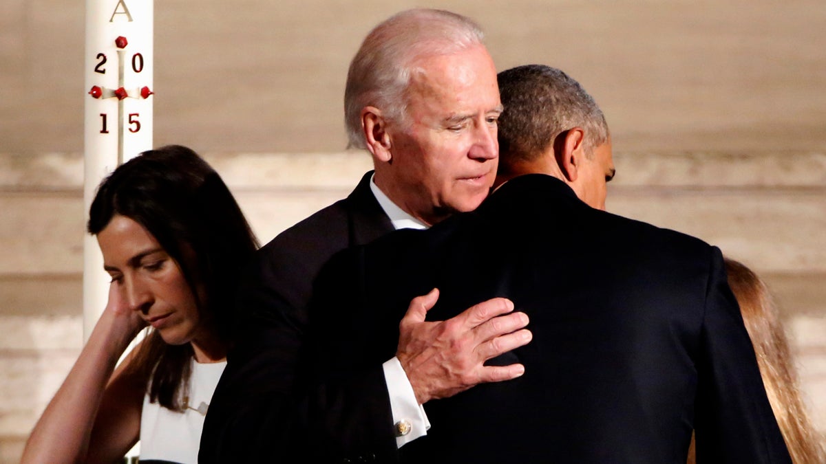 President Barack Obama hugs Vice President Joe Biden during funeral services for Biden's son, Beau Biden, Saturday, June 6, 2015, at St. Anthony of Padua Church in Wilmington, Del. (Yuri Gripas/Pool Photo via AP)