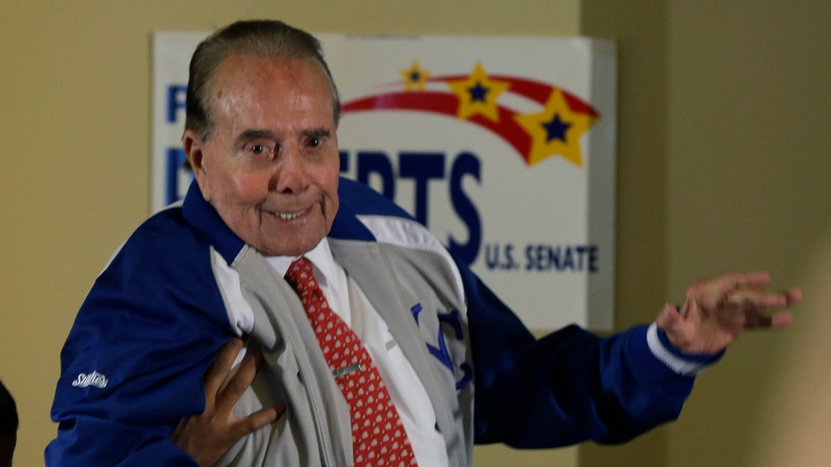  Former Sen. Bob Dole, R-Kan., appears at a rally for Sen. Pat Roberts in Overland Park, Kan., Monday, Oct. 27, 2014. (Orlin Wagner/AP Photo) 