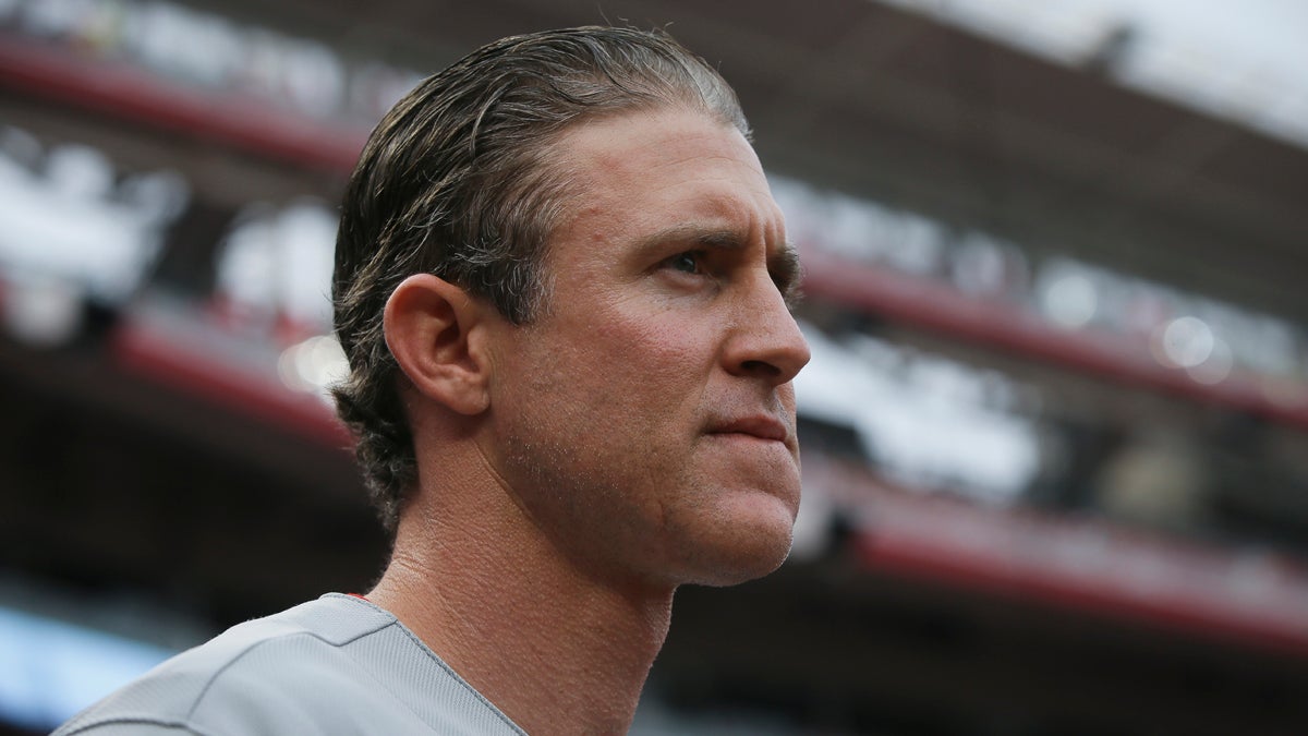 Philadelphia Phillies' Chase Utley stands in the dugout during a baseball game against the Cincinnati Reds June 9 in Cincinnati. (John Minchillo/AP Photo)