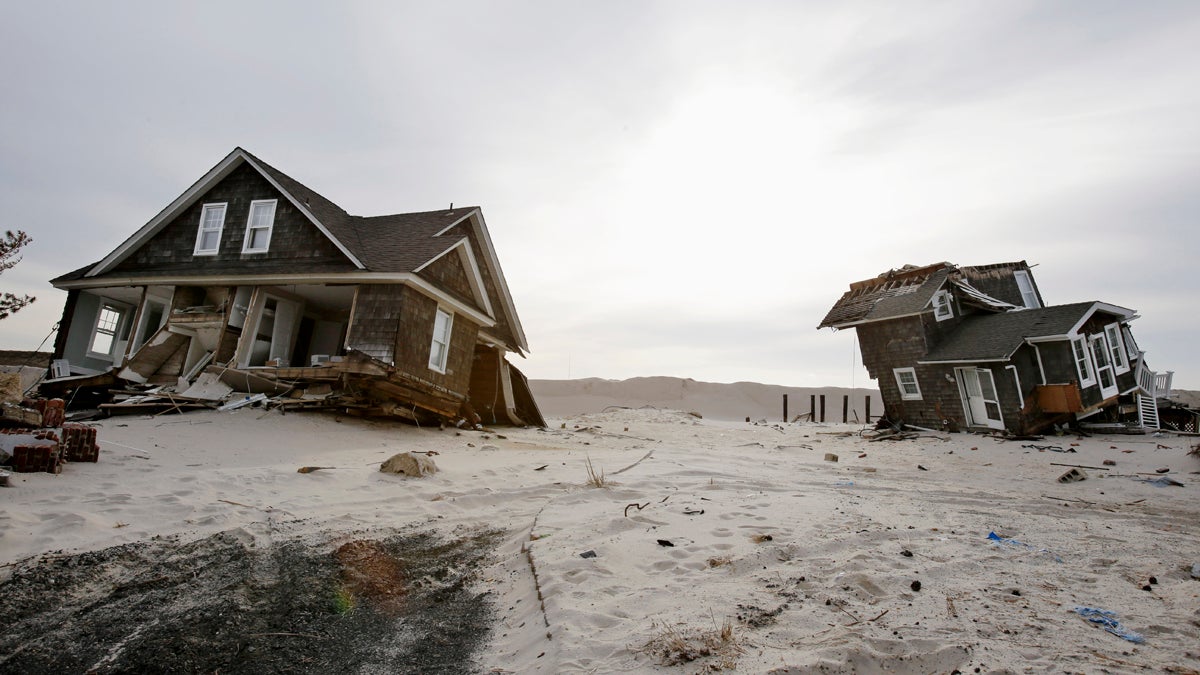 This Feb. 22, 2013 file photo shows two heavily damaged homes on the beach in Mantoloking, N.J., from Superstorm Sandy. (Mel Evans/AP Photo, file) 