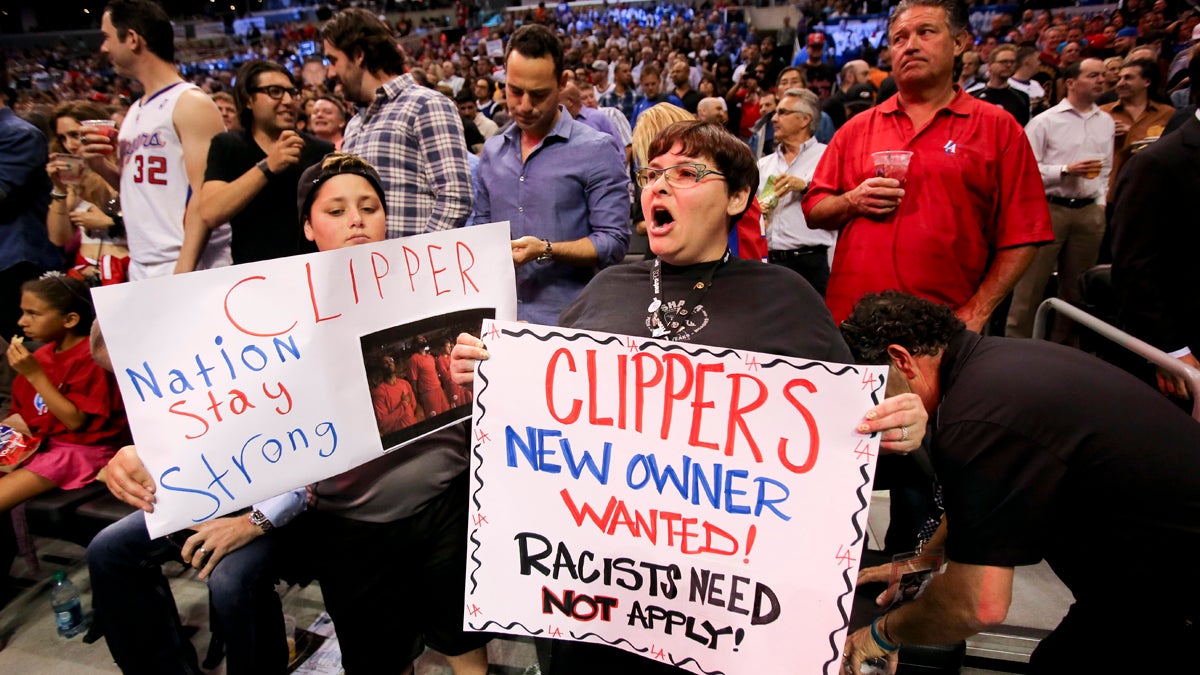  Fans hold up signs in support of the Los Angeles Clippers before Game 5 of an opening-round NBA basketball playoff series between the Clippers and the Golden State Warriors on Tuesday, April 29, 2014, in Los Angeles. NBA Commissioner Adam Silver announced Tuesday that Clippers owner Donald Sterling has been banned for life by the league. (Ringo H.W. Chiu/AP Photo) 