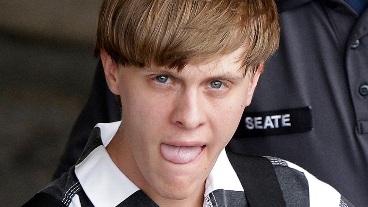  Charleston, S.C., shooting suspect Dylann Storm Roof is escorted from the Cleveland County Courthouse in Shelby, N.C., Thursday, June 18, 2015. Roof is a suspect in the shooting of several people Wednesday night at the historic The Emanuel African Methodist Episcopal Church in Charleston. (Chuck Burton/AP Photo) 