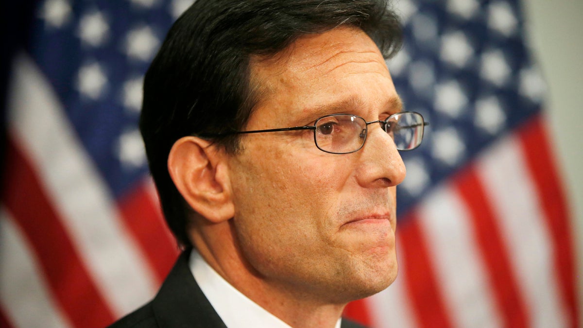  House Majority Leader Eric Cantor of Va. speaks to reporters on Capitol Hill in Washington, Wednesday, June 11, 2014, after a House Republican caucus meeting. Repudiated at the polls, House Majority Leader Eric Cantor intends to resign his leadership post at the end of next month, officials said Wednesday, clearing the way for a potentially disruptive Republican shake-up just before midterm elections with control of Congress at stake. (Charles Dharapak/AP Photo) 