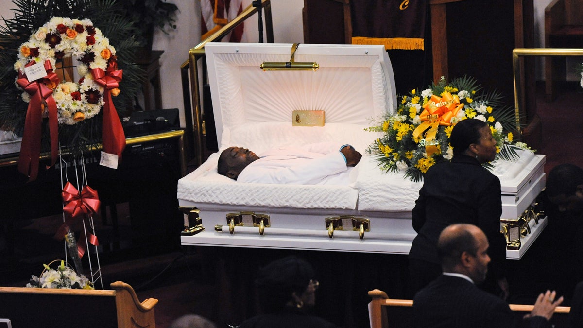In this July 23, 2014 file photo, Eric Garner's body lies in a casket during his funeral at Bethel Baptist Church in the Brooklyn borough of New York. Garner died in police custody after an officer placed him in an apparent chokehold. Staten Island District Attorney Daniel Donovan announced Tuesday, Aug. 19, 2014, that an extra grand jury will be impaneled to hear evidence next month in the July 17 death of Garner. Donovan says his decision is based on his office's investigation and the medical examiner's ruling that the death was homicide. (AP Photo/New York Daily News, Julia Xanthos, Pool, File) 
