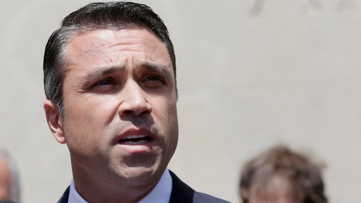  U.S. Rep. Michael Grimm speaks at a news conference in a park next to federal court, Monday, April 28, 2014, in the Brooklyn borough of New York. The Staten Island Republican was arrested earlier in the day and pleaded not guilty to a 20-count federal indictment that includes charges of mail fraud, wire fraud and tax fraud. (Mark Lennihan/AP Photo) 