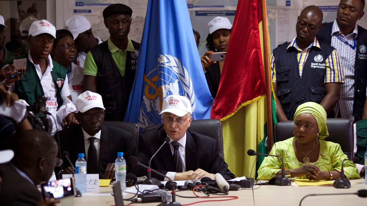  Mohamed Belhocine (center), a representative from the World Health Organization,  speaks during a press briefing in Conakry, Guinea, last month. Guinea has been declared free from transmission of Ebola, the World Health Organization said Tuesday, marking a milestone for the West African country where the original Ebola chain of transmission began two years ago leading to the largest epidemic in history. (Youssouf Bah/AP Photo) 