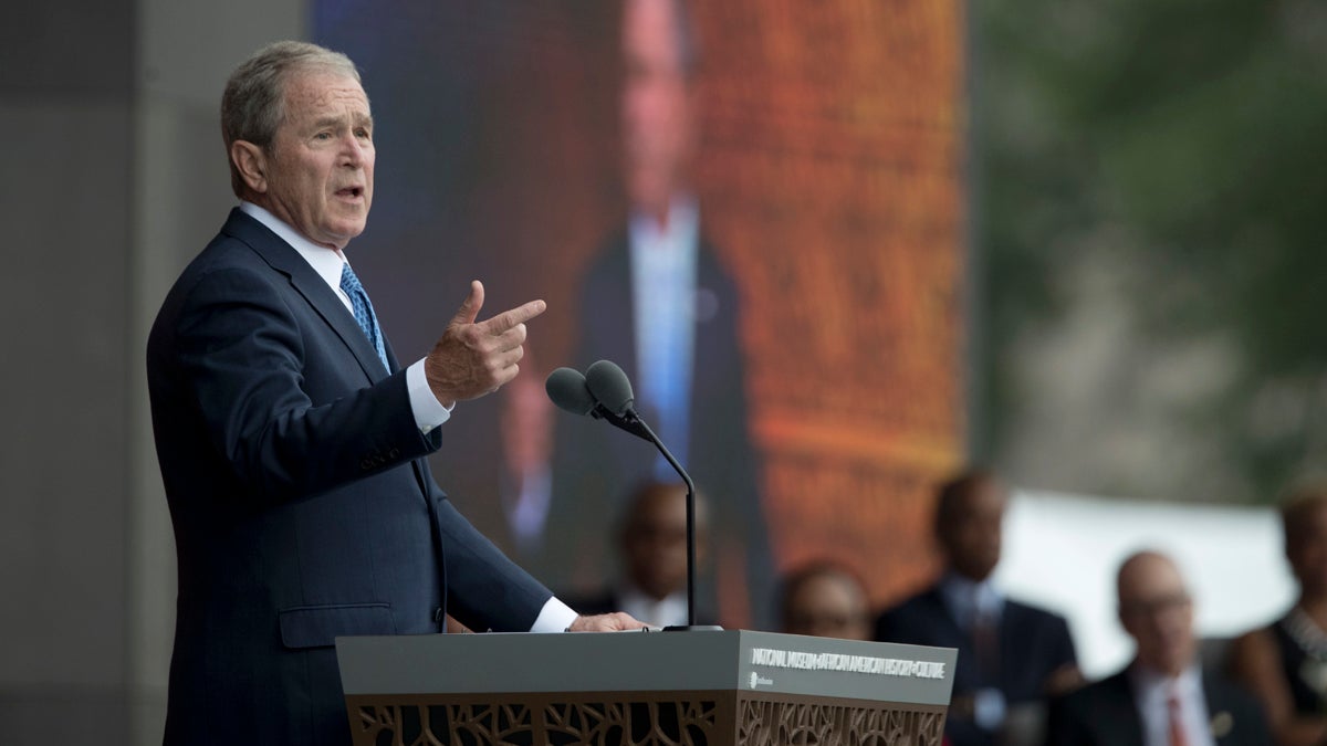 Former President George W. Bush speaks during the opening ceremony of the Smithsonian National Museum of African American History and Culture on the National Mall in Washington