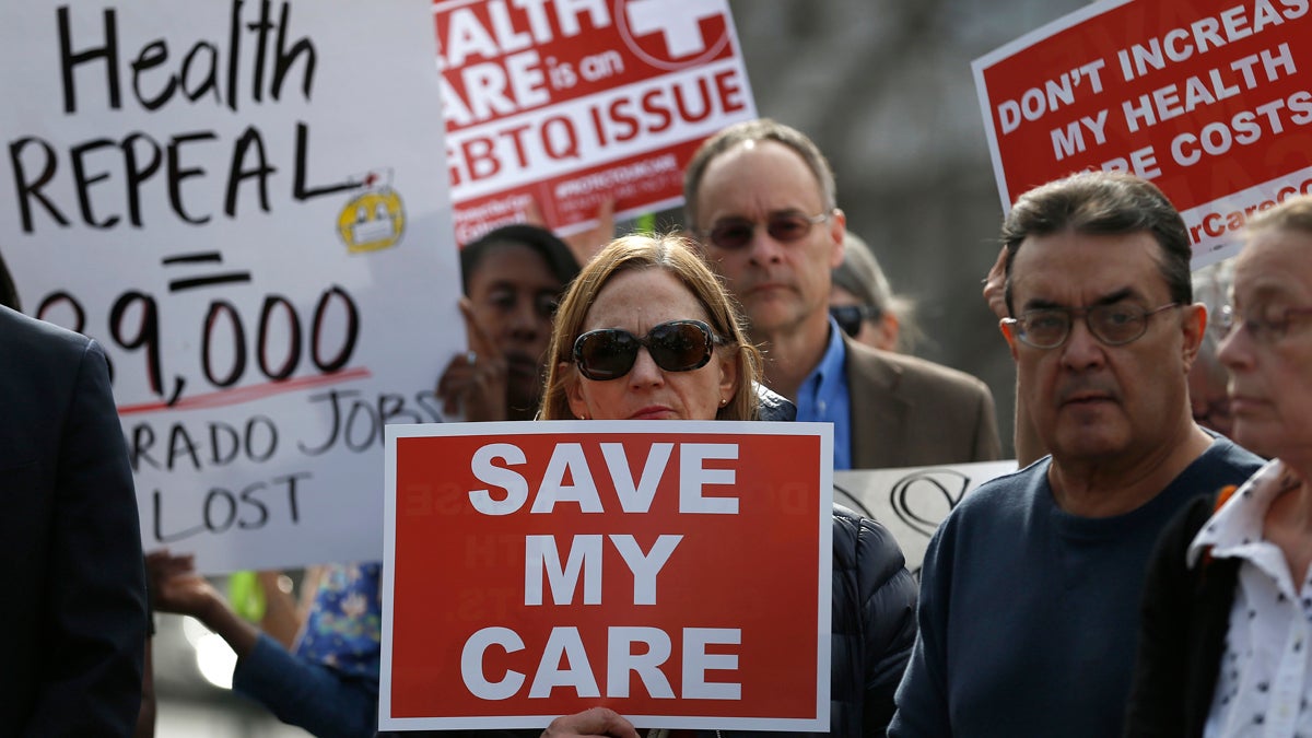 Supporters of the Affordable Care Act who are also opponents of Colorado's GOP-led plan to undo Colorado's state-run insurance exchange gather for a rally organized by the national Save My Care Bus Tour