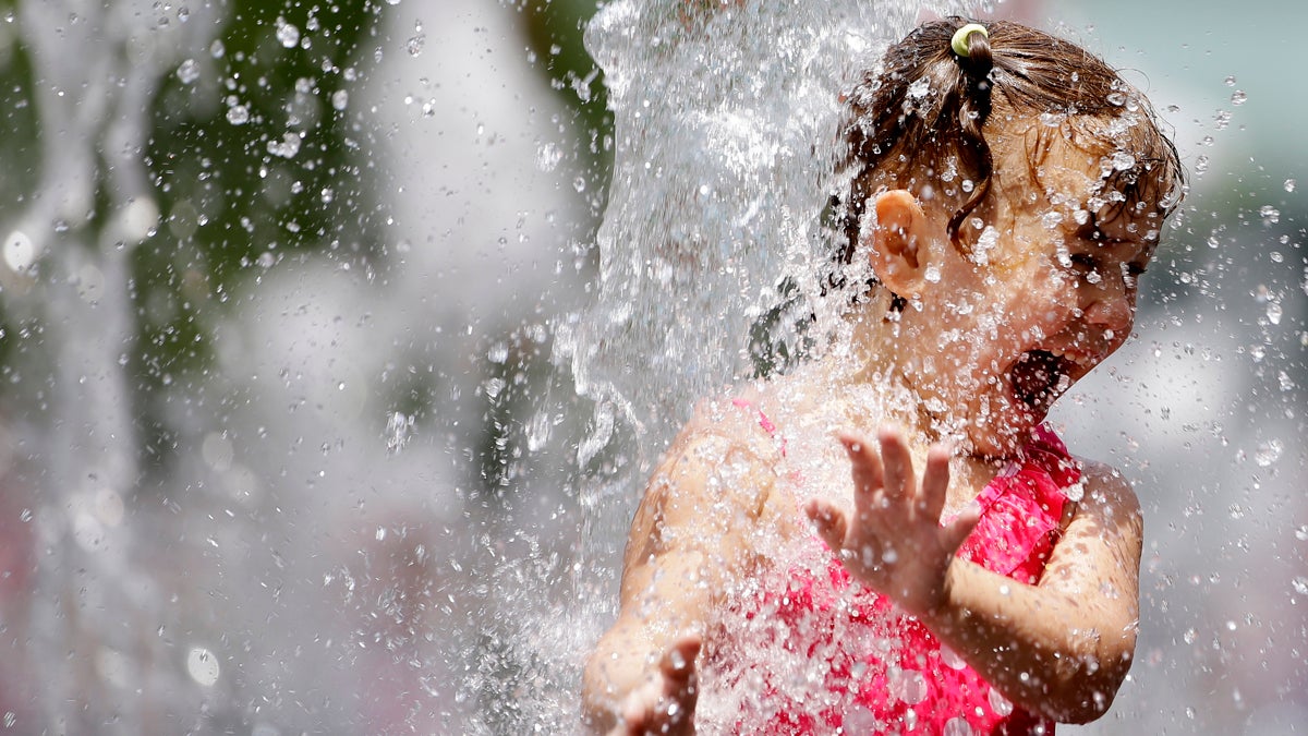  Jordyn Chin, 5, plays in the fountain at Dilworth Park Friday, June 12, 2015, in Philadelphia. (Matt Rourke/AP Photo) 