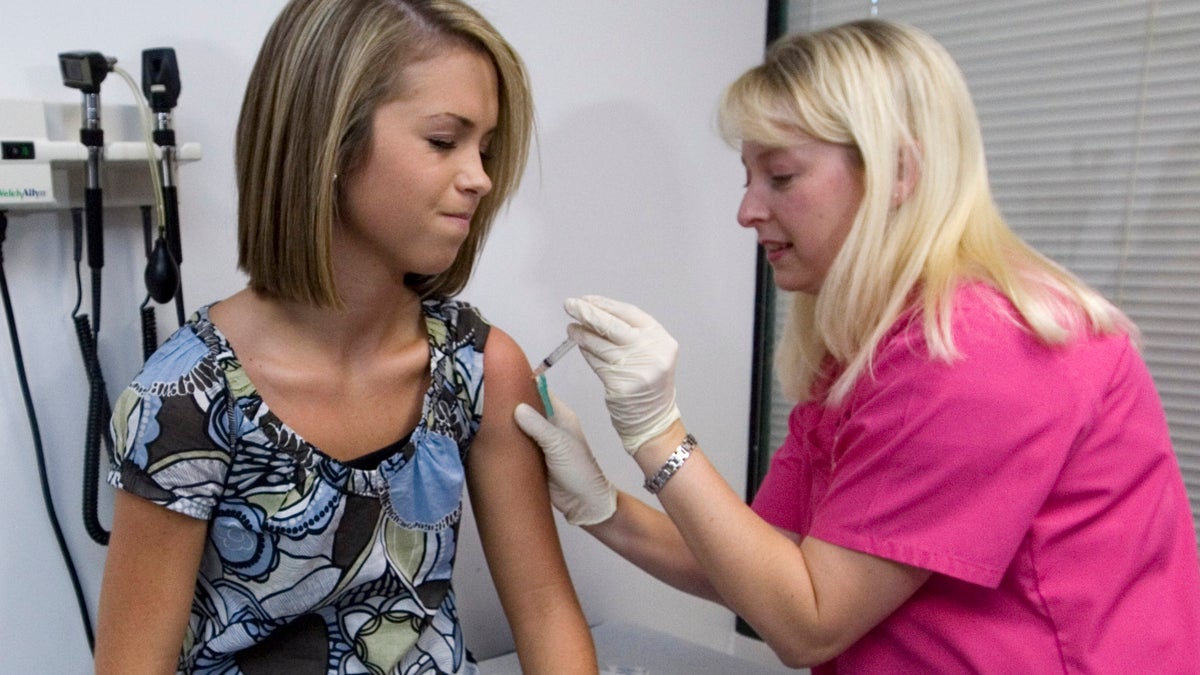  In this Dec. 18, 2007 file photo, a patient winces as she has her third and final application of the Human Papillomavirus (HPV) vaccine administered by a nurse at a doctor's office (John Amis/AP Photo, File) 