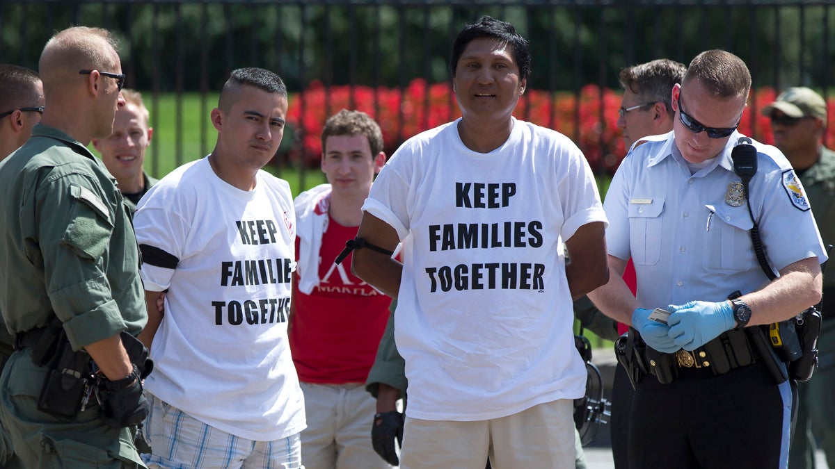  Demonstrators are arrested outside the White House in Washington, Thursday, Aug. 28, 2014, during a protest for immigration reform. (Evan Vucci/AP Photo) 
