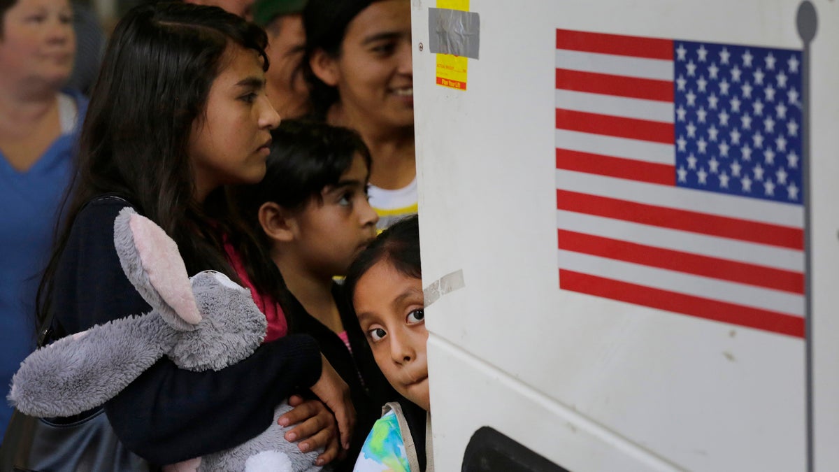  In this July 7, 2015 file photo, immigrants from El Salvador and Guatemala who entered the country illegally board a bus after they were released from a family detention center in San Antonio. A group of immigrant rights lawyers in a filing Thursday, Aug. 13, 2015, say that detention of women and children caught crossing the U.S.-Mexico border illegally is lengthy and unsafe, challenging the government's claims that immigrant families are held only briefly and that their detention doesn't violate a longstanding ban. (Eric Gay/AP Photo, File) 