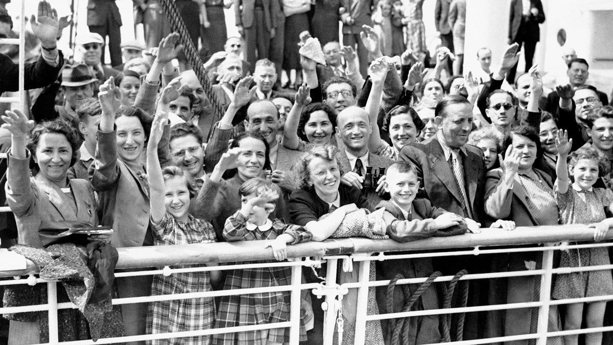  German Jewish refugees returned to Antwerp, Belgium, aboard the liner St. Louis after they had been denied entrance to Cuba. A small group of the 907 refugees are shown here, smiling in the face of their adversity, as they arrived at Antwerp after their long voyage on June 17, 1939 in Belgium. (AP Photo) 