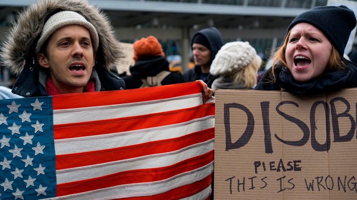 Protesters assemble at John F. Kennedy International Airport in New York, Saturday, Jan. 28, 2017 after two Iraqi refugees were detained while trying to enter the country. On Friday, Jan. 27, President Donald Trump signed an executive order suspending all immigration from countries with terrorism concerns for 90 days. Countries included in the ban are Iraq, Syria, Iran, Sudan, Libya, Somalia and Yemen, which are all Muslim-majority nations. (AP Photo/Craig Ruttle)