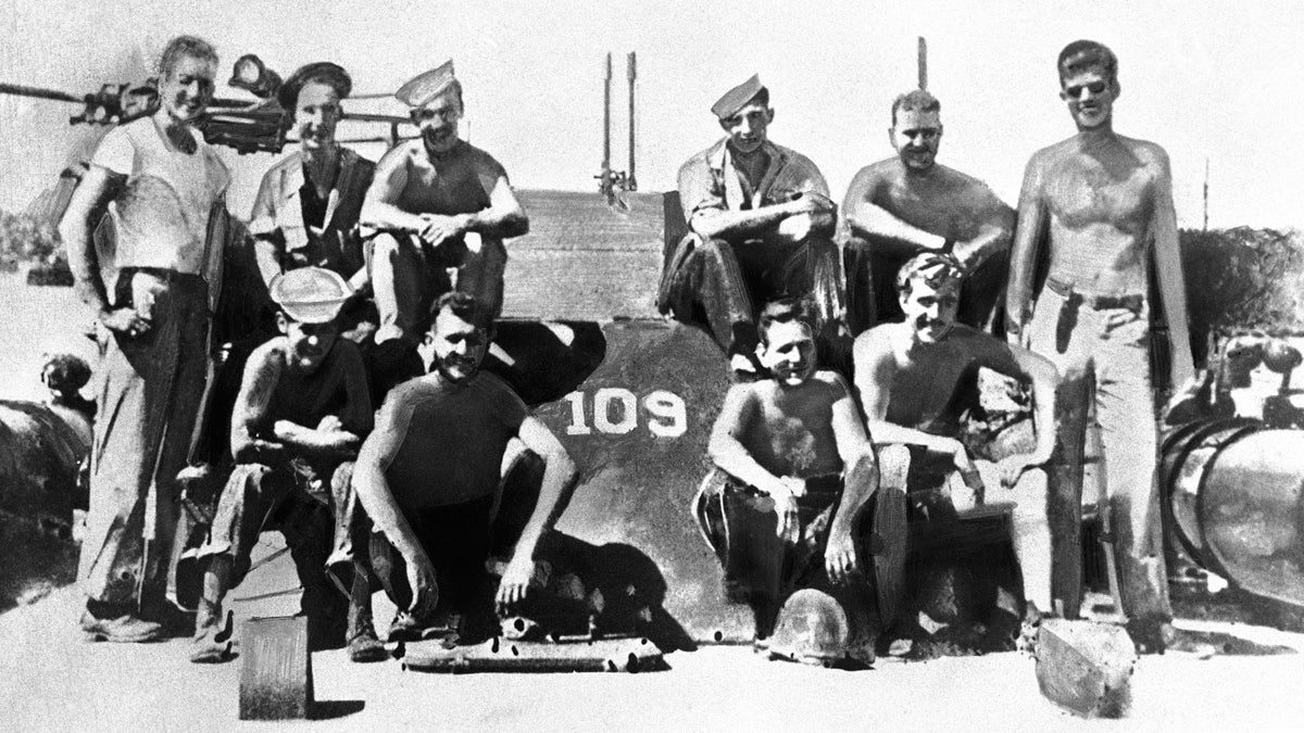  Lieutenant John F. Kennedy, (right), and his PT 109 crew are shown somewhere in the South Pacific, July 1943. (AP Photo) 