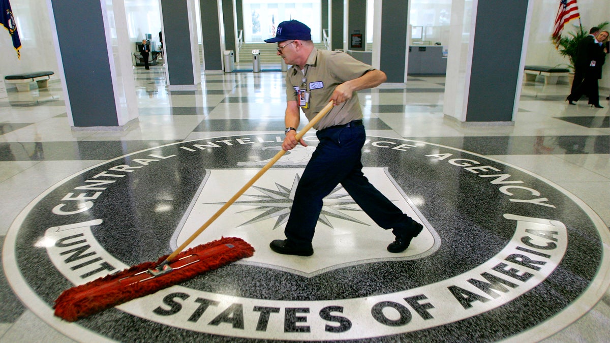  In this March 3, 2005 file photo, a workman slides a dustmop over the floor at the Central Intelligence Agency headquarters in Langley, Va. Senate investigators have delivered a damning indictment of CIA interrogation practices after the 9/11 attacks, accusing the agency of inflicting pain and suffering on prisoners with tactics that went well beyond legal limits. The torture report released Tuesday by the Senate Intelligence Committee says the CIA deceived the nation with its insistence that the harsh interrogation tactics had saved lives. It says those claims are unsubstantiated by the CIA's own records. (J. Scott Applewhite/AP Photo) 
