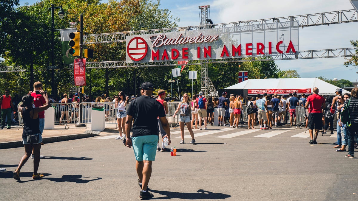 People walk into the Made in America festival on Sunday