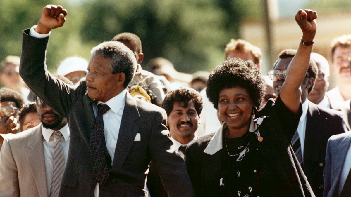  In this Feb. 11, 1990, file photo, Nelson Mandela and his wife, Winnie, raise clenched fists as they walk hand-in-hand upon his release from prison in Cape Town, South Africa. (Greg English/AP Photo, file)  