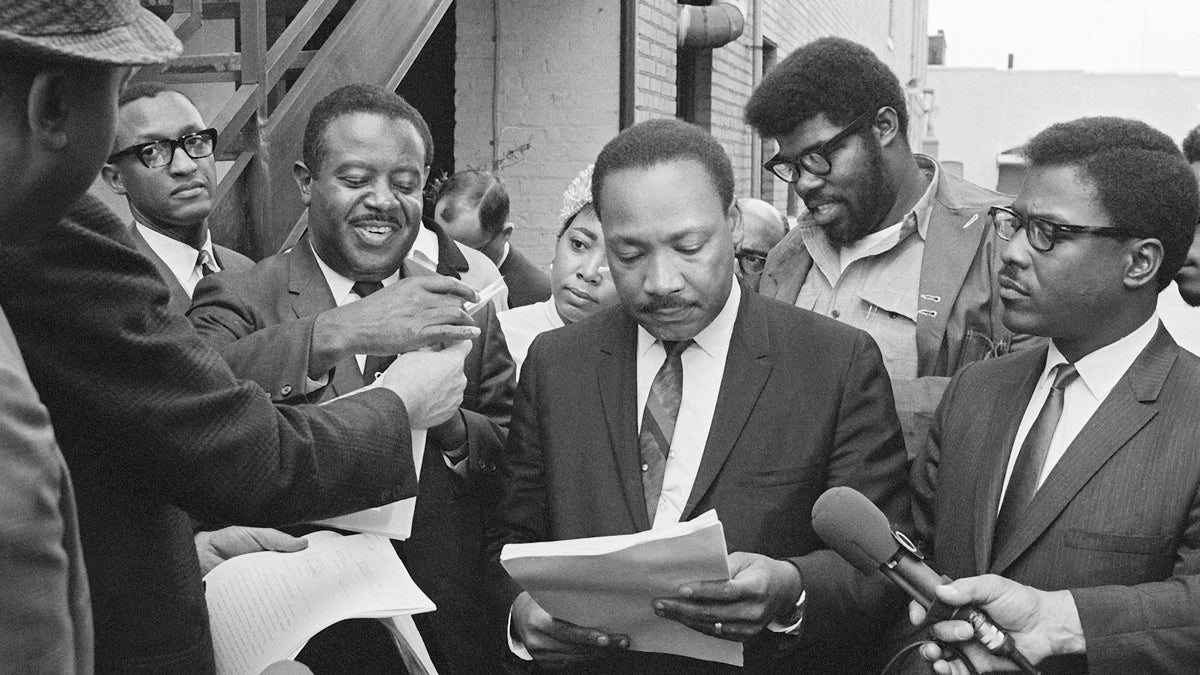  Civil rights leader Dr. Martin Luther King pictured on Thursday Apr. 3, 1968. King and his aides were being served papers by U.S. Marshal. A federal restraining order prohibited King from leading any mass marches. (AP Photo)  