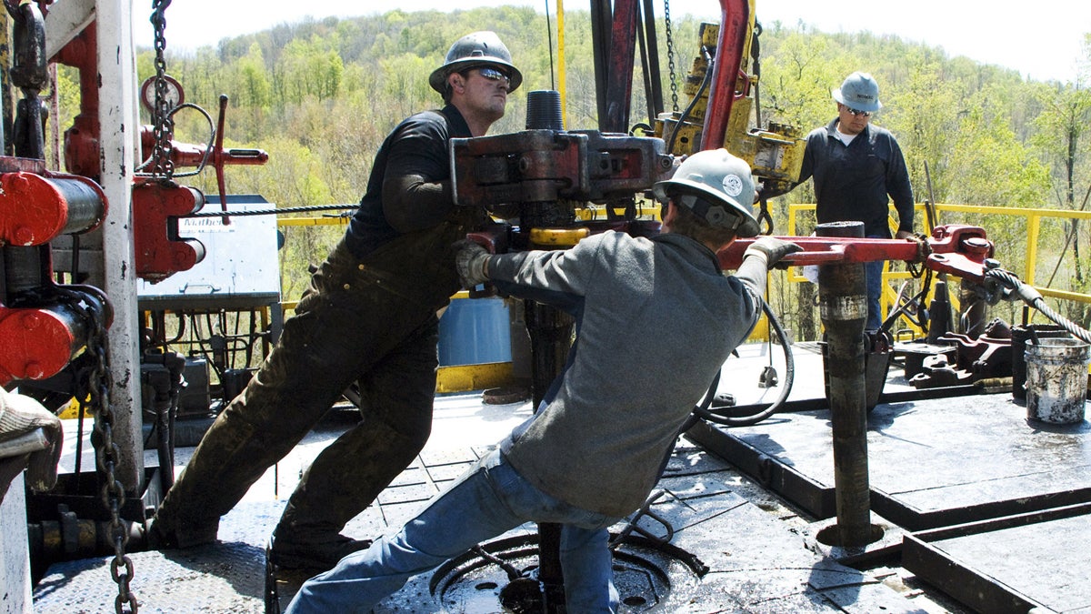  In this April 23, 2010 file photo, workers move a section of well casing into place at a Chesapeake Energy natural gas well site near Burlington, Pa., in Bradford County. (Ralph Wilson/AP Photo, file) 