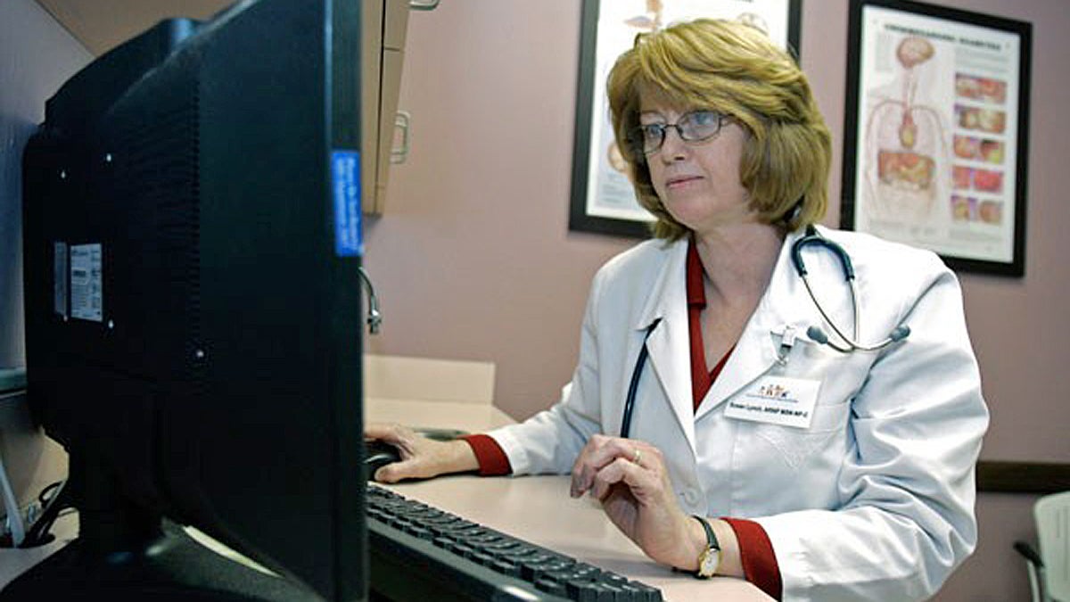  Susan Lynch, a nurse practitioner, checks over a patients electronic medical records (John Raoux/AP Photo)  