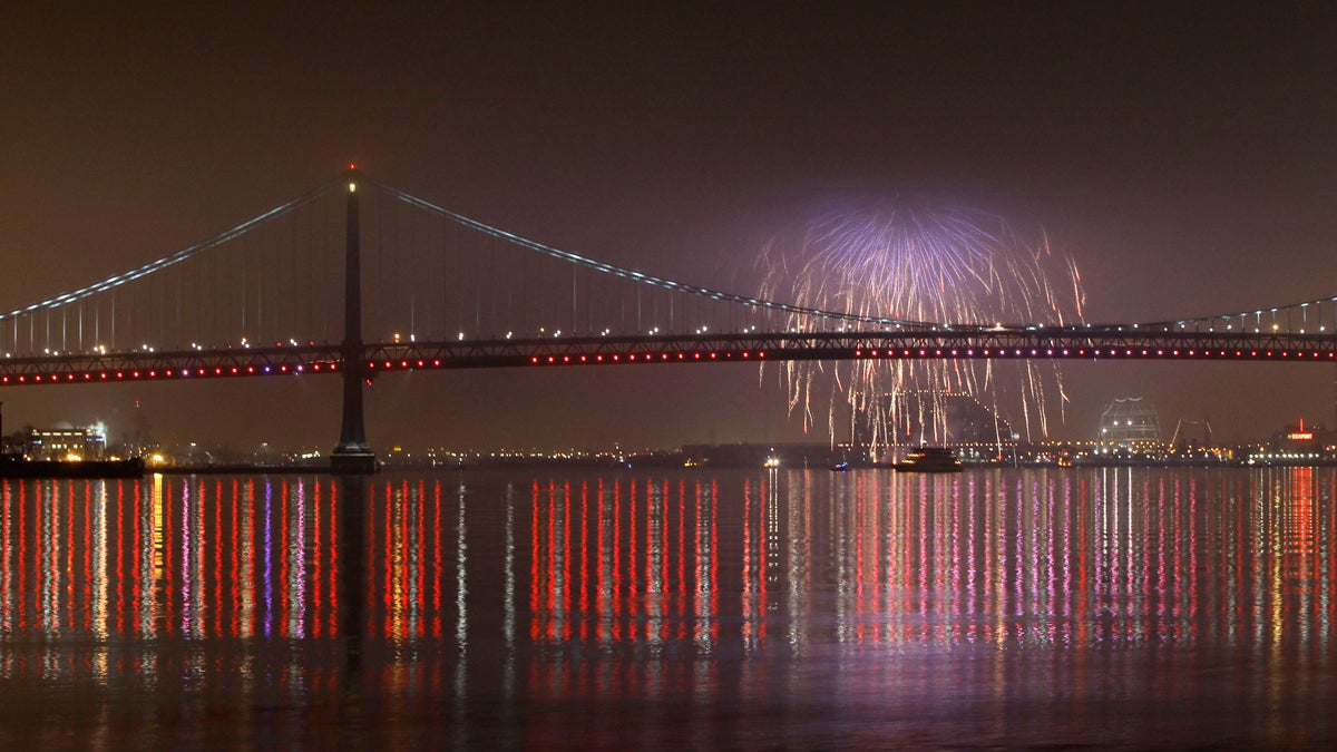  File photo: Fireworks explode in the foggy night sky above the Benjamin Franklin Bridge during a New Years celebration (Matt Slocum/AP Photo, file) 