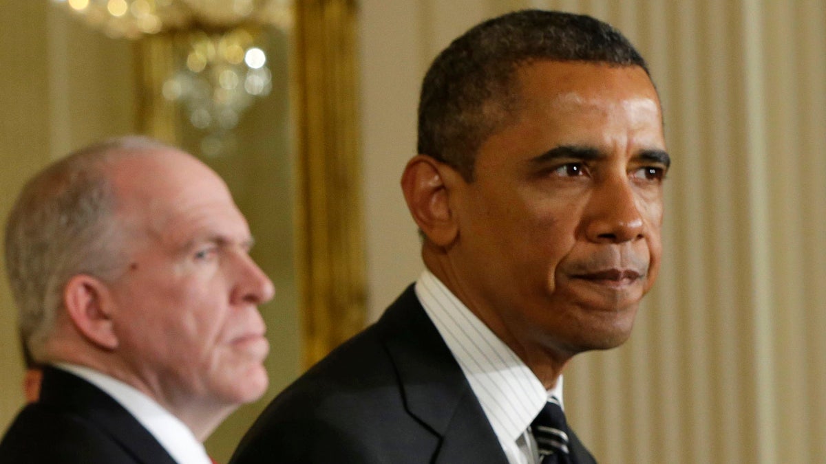  President Barack Obama and CIA Director John Brennan (left) in the East Room of the White House (Pablo Martinez Monsivais/AP Photo) 