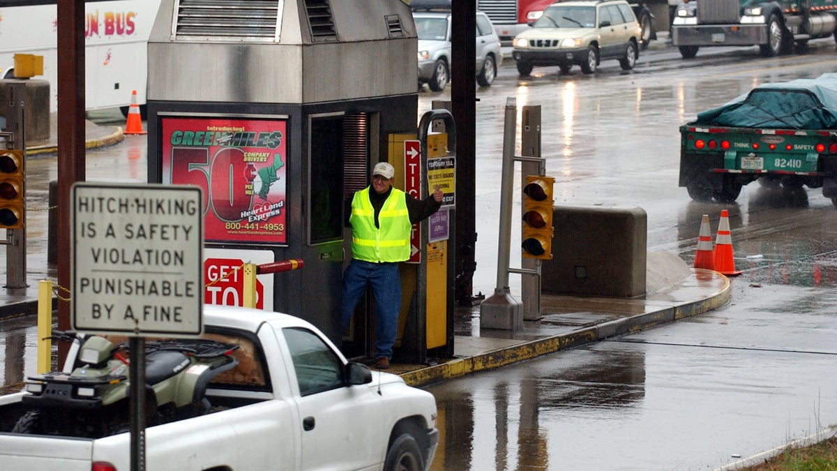 A toll worker gives a motorist a thumbs-up after waving a car past the ticket booth in Carlisle, Pa. (Carolyn Kaster/AP Photo) 