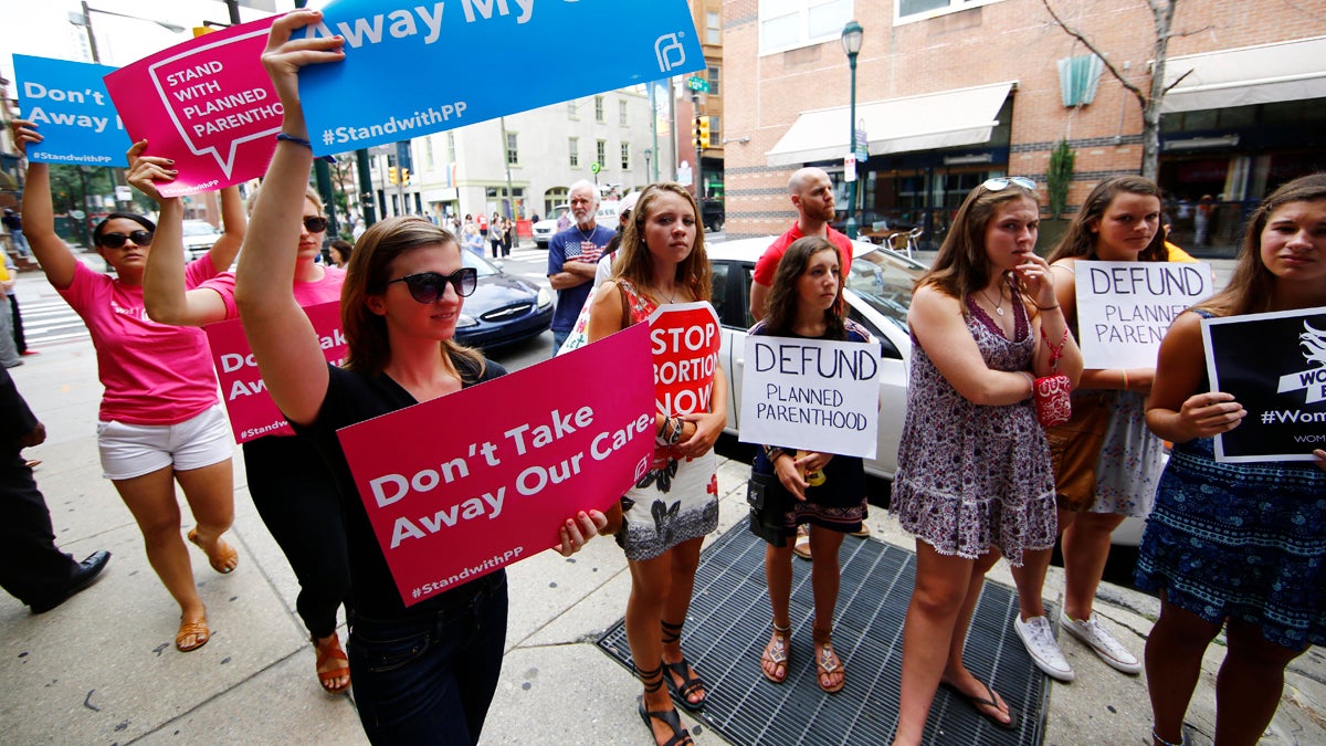  Opponents and supporters of Planned Parenthood demonstrate last month in Philadelphia. (Matt Rourke/AP Photo) 