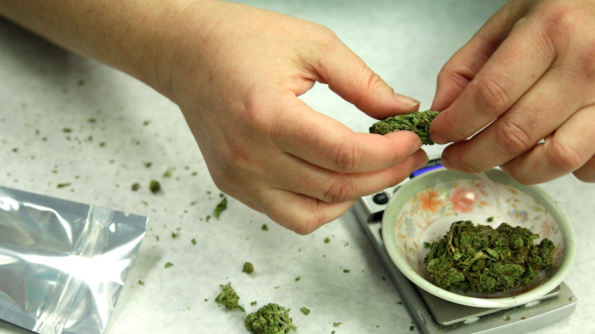 In this Oct. 10, 2012 file photo, marijuana is weighed and packaged for sale (Ted S. Warren/AP Photo, file) 