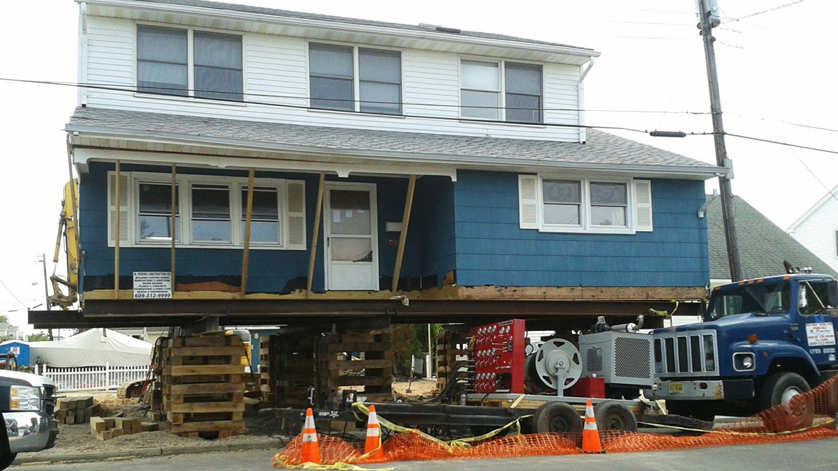 This Sept. 14, 2013 photo provided by John Paynter shows his house after it was raised in Long Beach Island, N.J. Paynter's vacation home now stands 13 feet higher than it did before Superstorm Sandy. The National Flood Insurance Program (NFIP) says floods are the No. 1 natural disaster in the U.S., with insurance claims totaling on average more than $3 billion annually from 2003 to 2012. (John Paynter/AP Photo) 