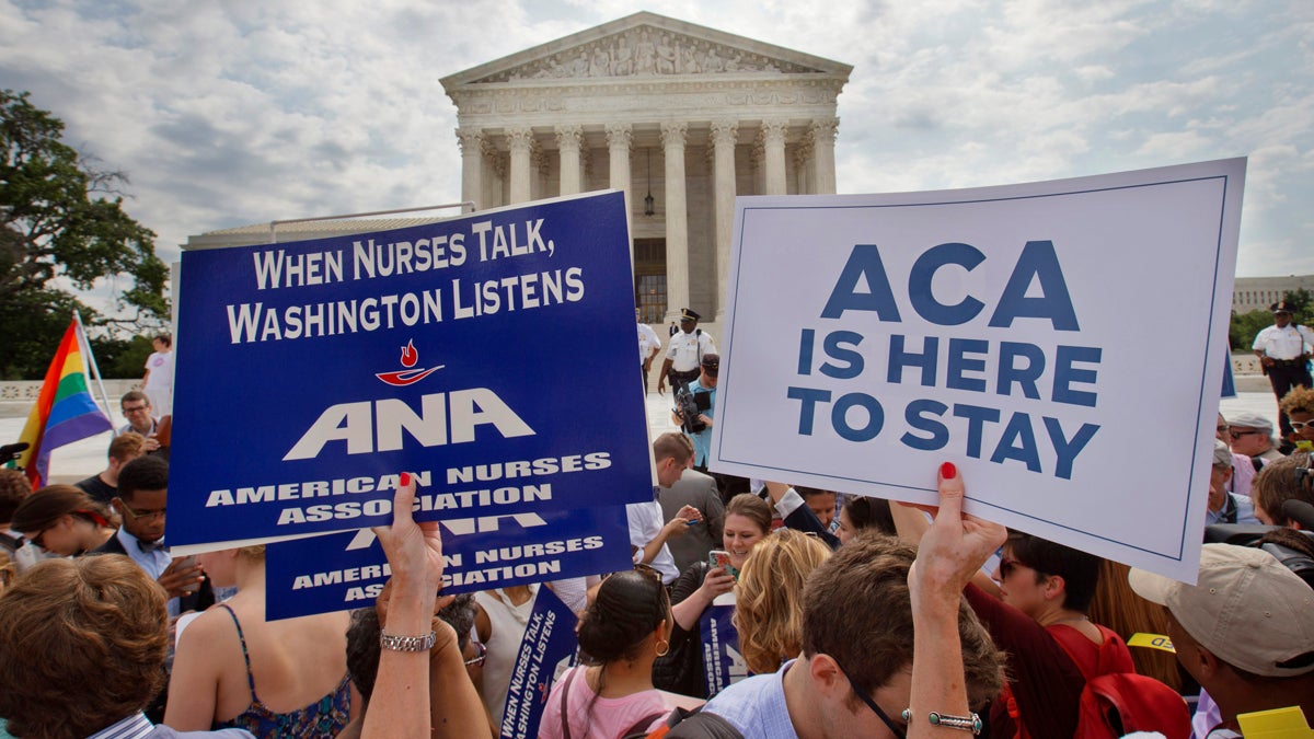  Supporters of the Affordable Care Act hold up signs as the opinion for health care is reported outside of the Supreme Court in Washington, Thursday June 25, 2015. The Supreme Court on Thursday upheld the nationwide tax subsidies under President Barack Obama's health care overhaul, in a ruling that preserves health insurance for millions of Americans. The justices said in a 6-3 ruling that the subsidies that 8.7 million people currently receive to make insurance affordable do not depend on where they live, under the 2010 health care law. (Jacquelyn Martin/AP Photo)  