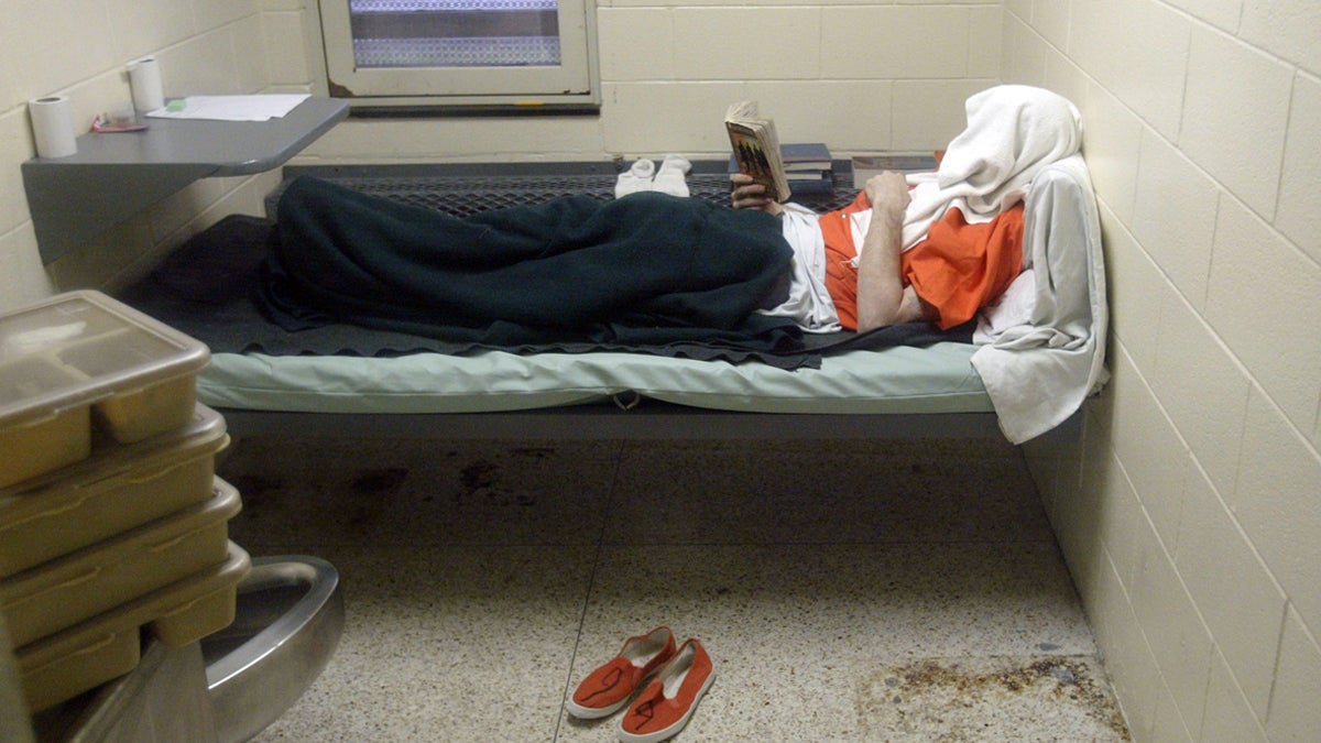  In this 2010 photo, an inmate who was transferred from the Pennsylvania Department of Corrections lies in his cell in a segregated area alone as punishment (Ken Stevens/AP Photo/The Muskegon Chronicle) 