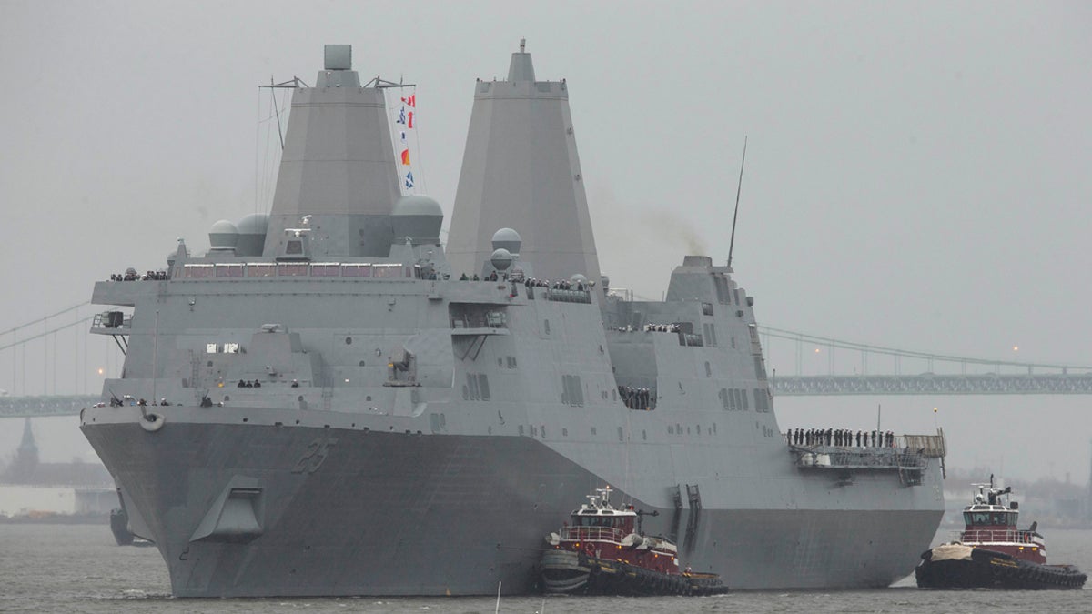  USS Somerset makes its way to Penn's Landing along the Delaware River, Friday, Feb. 21, 2014, in Philadelphia. The amphibious transport dock scheduled to be commissioned March 1, is the last of three vessels honoring 9/11 victims and first responders. It joins the USS New York and the USS Arlington. (AP Photo/Matt Rourke) 