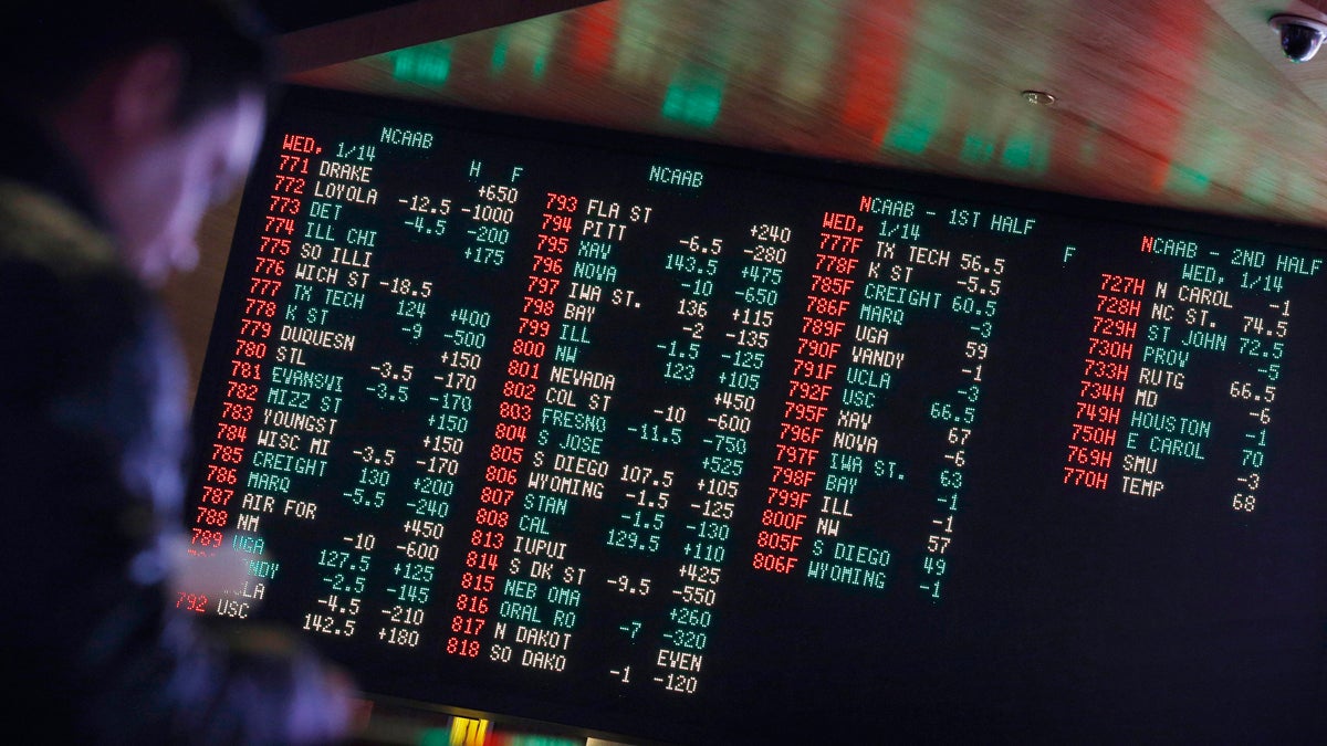 In this Jan. 14, 2015, file photo, odds are displayed on a screen at a sports book owned and operated by CG Technology in Las Vegas. (John Locher/AP Photo, File)