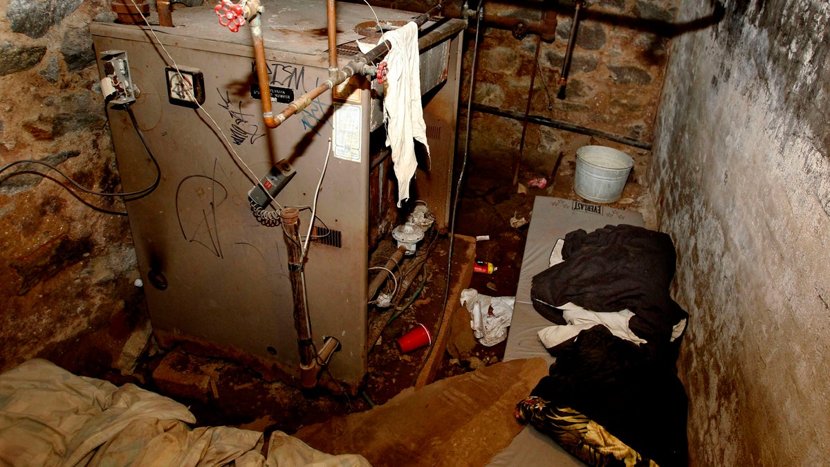  The dank basement room in Philadelphia where four weak and malnourished mentally disabled adults, one chained to the boiler, were found locked inside on Saturday is shown Monday, Oct. 17, 2011. (Ron Cortes/AP Photo, Pool) 