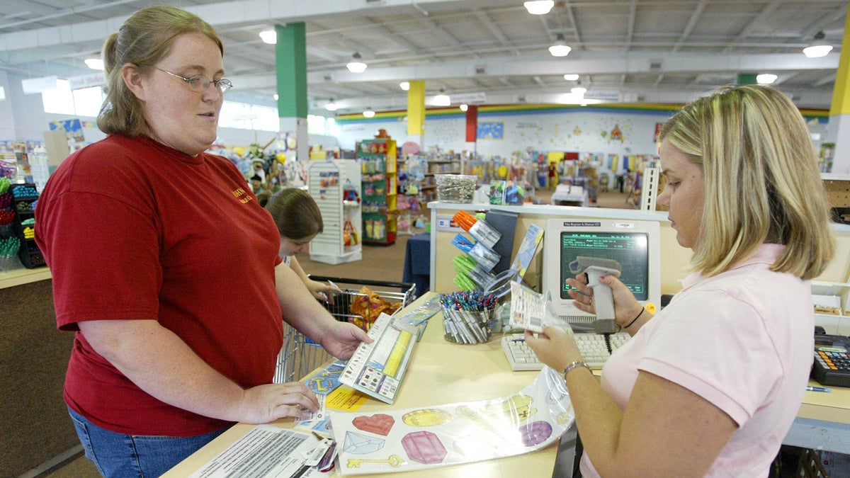 A sales associate rings up school supplies that a teacher is buying in this file photo (Wade Payne/AP Photo)