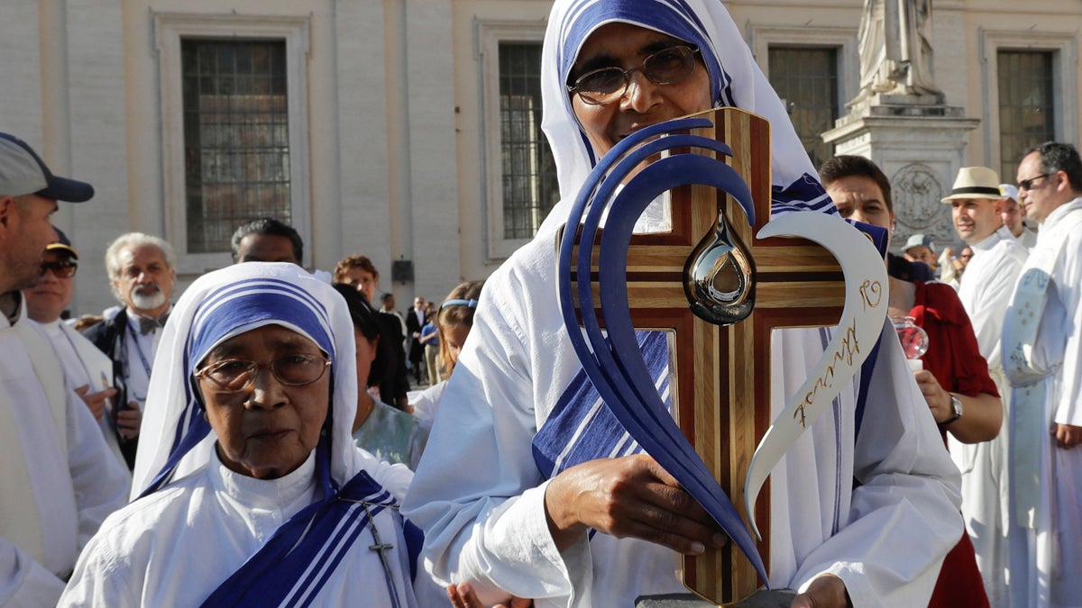 The relics of Mother Teresa are carried by nuns prior to the start of a mass celebrated by Pope Francis where she will be canonized in St. Peter's Square, at the Vatican, Sunday, Sept. 4, 2016. Thousands of pilgrims thronged to St. Peter's Square on Sunday for the canonization of Mother Teresa, the tiny nun who cared for the world's most unwanted and became the icon of a Catholic Church that goes to the peripheries to tend to lost, wounded souls. (AP Photo/Gregorio Borgia)