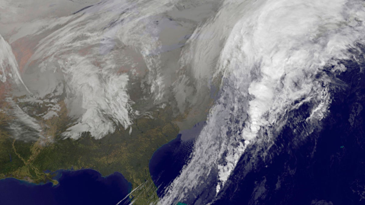  This satellite image taken at 5:30 p.m. EST on Wednesday, Nov. 26, 2014, and released by National Oceanic and Atmospheric Administration, shows a broad area of low pressure along the eastern seaboard of the United States. A sloppy mix of rain and snow rolled into the Northeast on Wednesday just as millions of Americans began the big Thanksgiving getaway, grounding hundreds of flights and turning highways hazardous along the congested Washington-to-Boston corridor. (AP Photo/NOAA) 