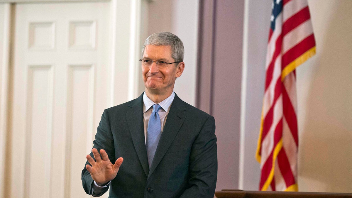  Apple chief executive and Alabama native Tim Cook waves to the crowd during an Alabama Academy of Honor ceremony at the state Capitol Monday, Oct. 27, 2014, in Montgomery, Ala. Cook and seven others including University of Alabama football coach Nick Saban were inducted into the Alabama Academy of Honor. (Brynn Anderson/AP Photo) 