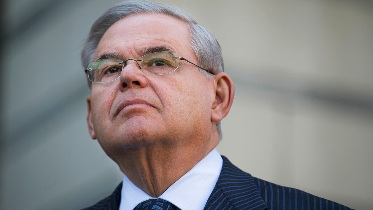  U.S. Sen. Bob Menendez waits to speak outside federal court, Thursday, April 2, 2015, in Newark, N.J. Menendez, the top Democrat on the U.S. Senate Foreign Relations Committee, was indicted on corruption charges, accused of using his office to improperly benefit an eye doctor and political donor. (AP Photo/John Minchillo) 