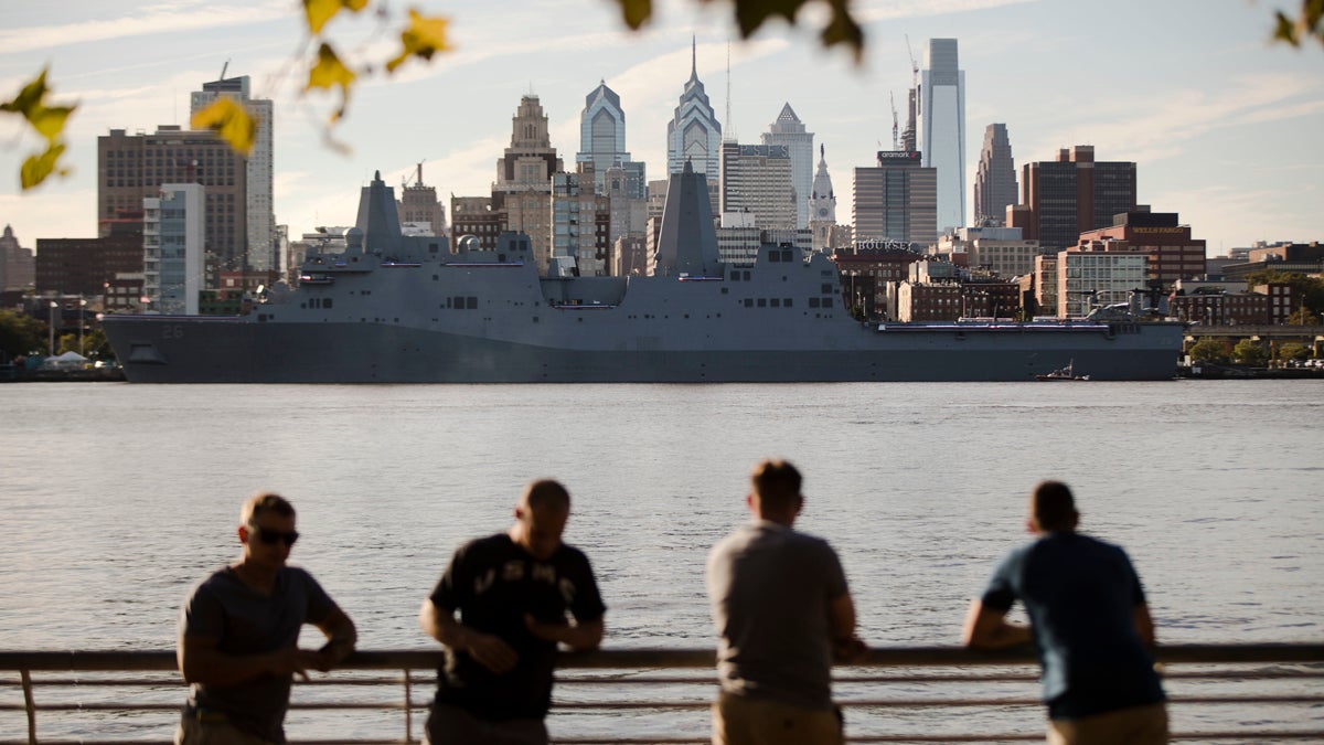The USS John P. Murtha stands along the along the skyline of Philadelphia