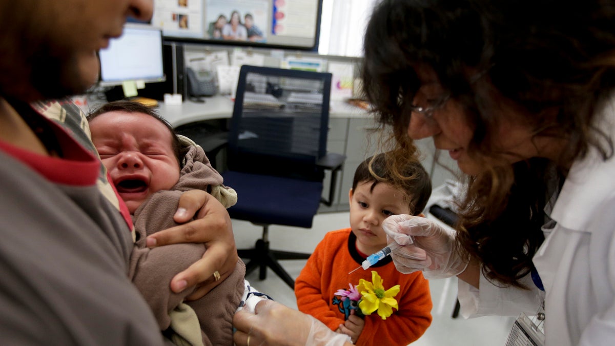  Julietta Losoyo, right, a registered nurse at the San Diego Public Health Center gives Derek Lucero a whooping cough injection while in his fathers Leonel's arms as his brother Iker, 2, looks on in San Diego. California is battling the worst whooping cough epidemic recorded in the state in seven decades. State officials place much of the blame on a vaccine introduced in the 1990s that researchers say doesn't seem to be working as well as expected. (AP Photo/Chris Carlson, File) 