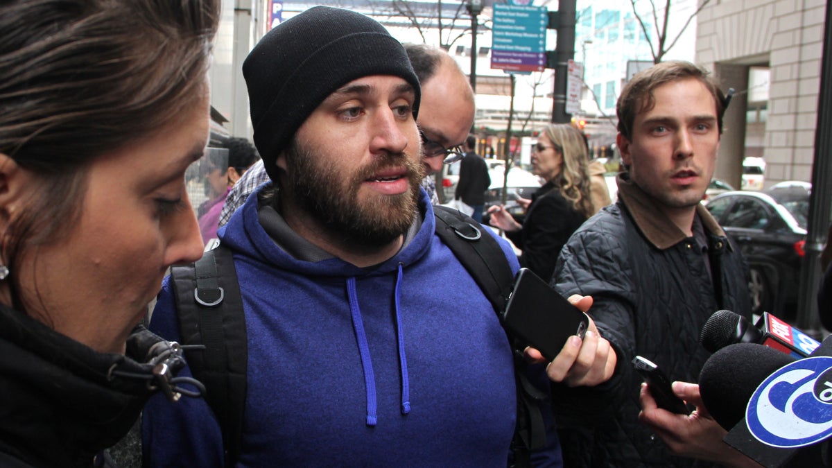  Juror Ari Duenas (center) talks with reporters after Kathryn Knott was convicted for her role in the assault of a gay couple in Center City. (Emma Lee/WHYY) 