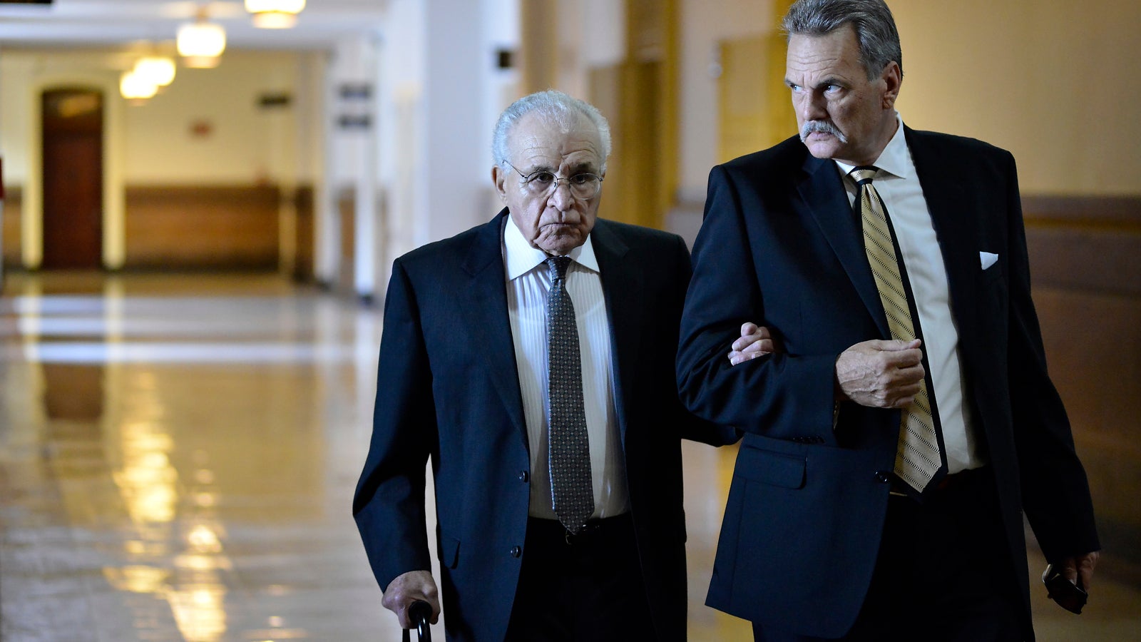 Richard Basciano (left)arrives at City Hall to testify in the civil trial that charges he has responsibility for the building collapse that killed six people in a Salvation Army thrift store in 2013. (Bastiaan Slabbers for NewsWorks)