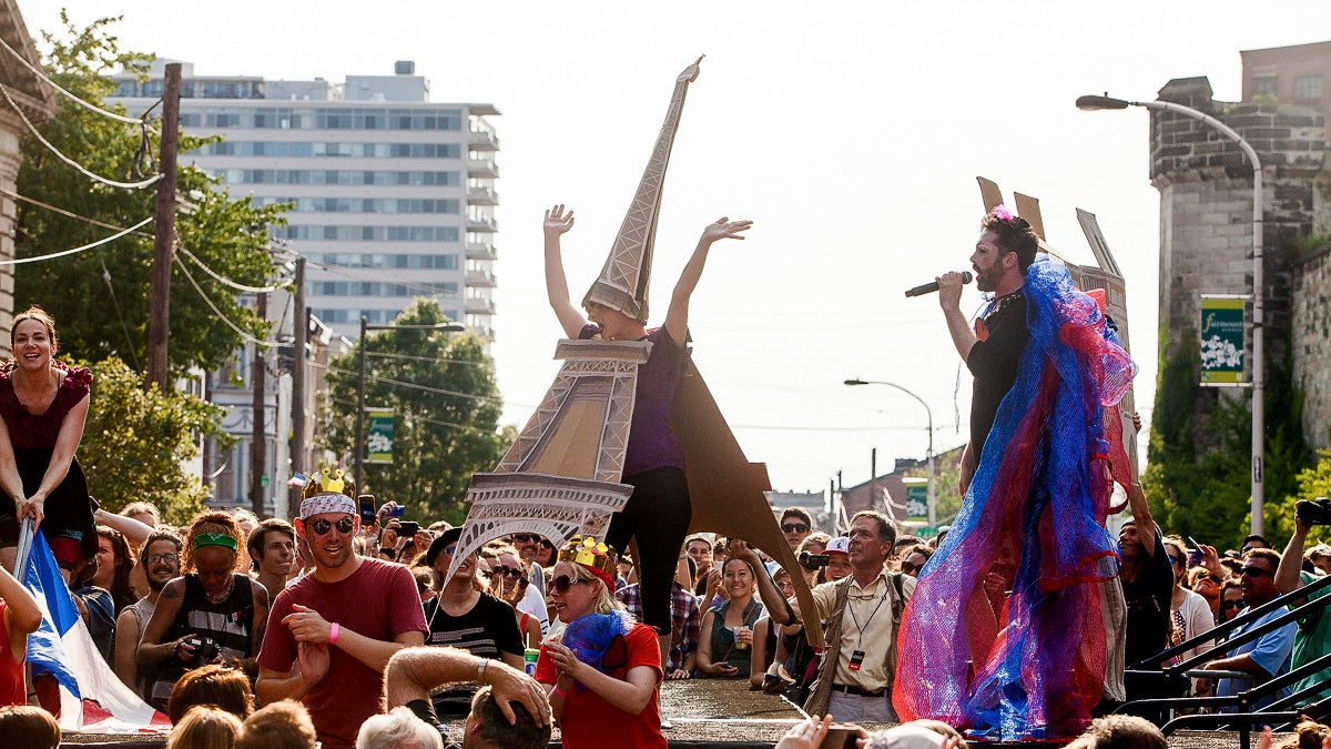  Edith Piaf, played by John Jarboe, performs a number with dancing French cultural icons such as the Eiffel Tower. (Brad Larrison/for NewsWorks) 