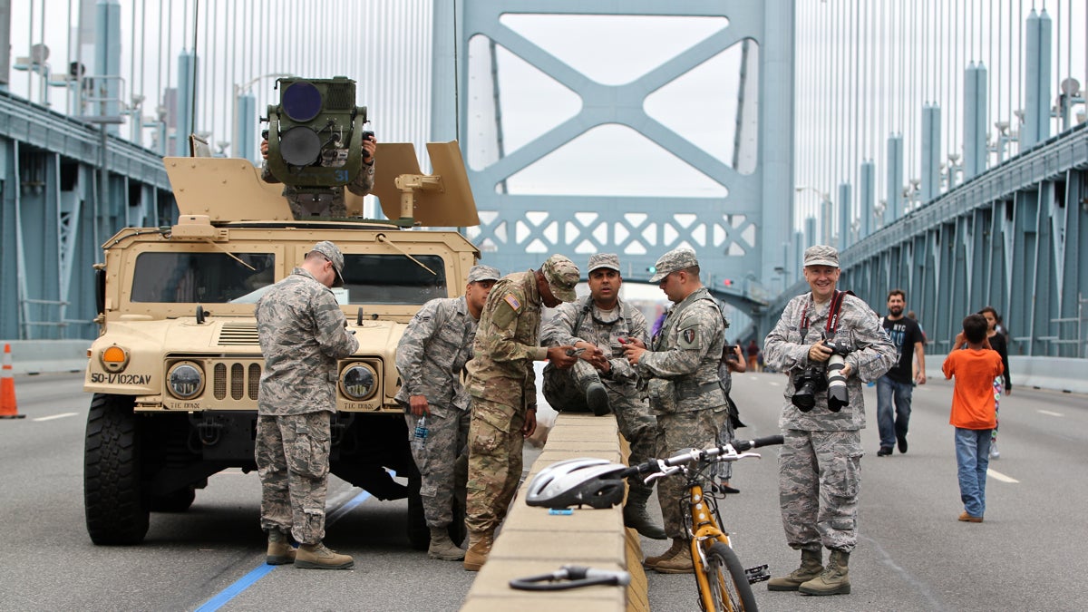  Members of the National Guard stand watch on the Ben Franklin Bridge during the papal visit (Emma Lee/WHYY) 